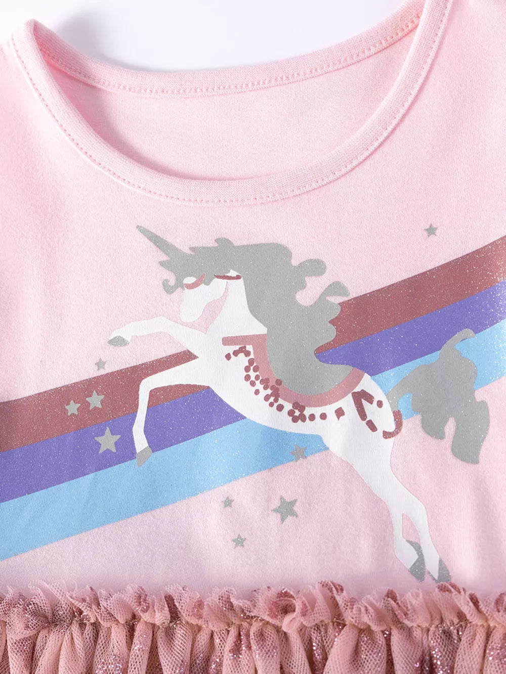 Pink toddler dress with unicorn, rainbow, and stars graphic, ruffled tulle hem.