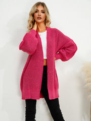 Hot Pink textured cocoon cardigan with balloon sleeves and open front.