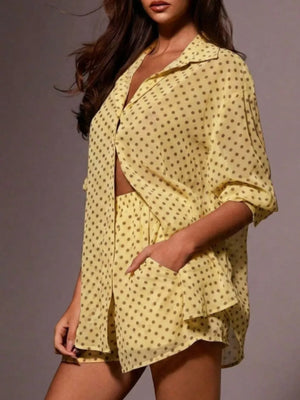 Yellow polka dot sheer two-piece set with collared shirt and shorts.