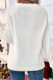 White acrylic knit sweater with festive red trim on neckline and hem.