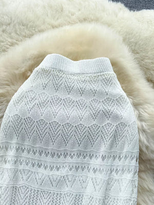White openwork maxi skirt with intricate knit pattern and elastic waistband.