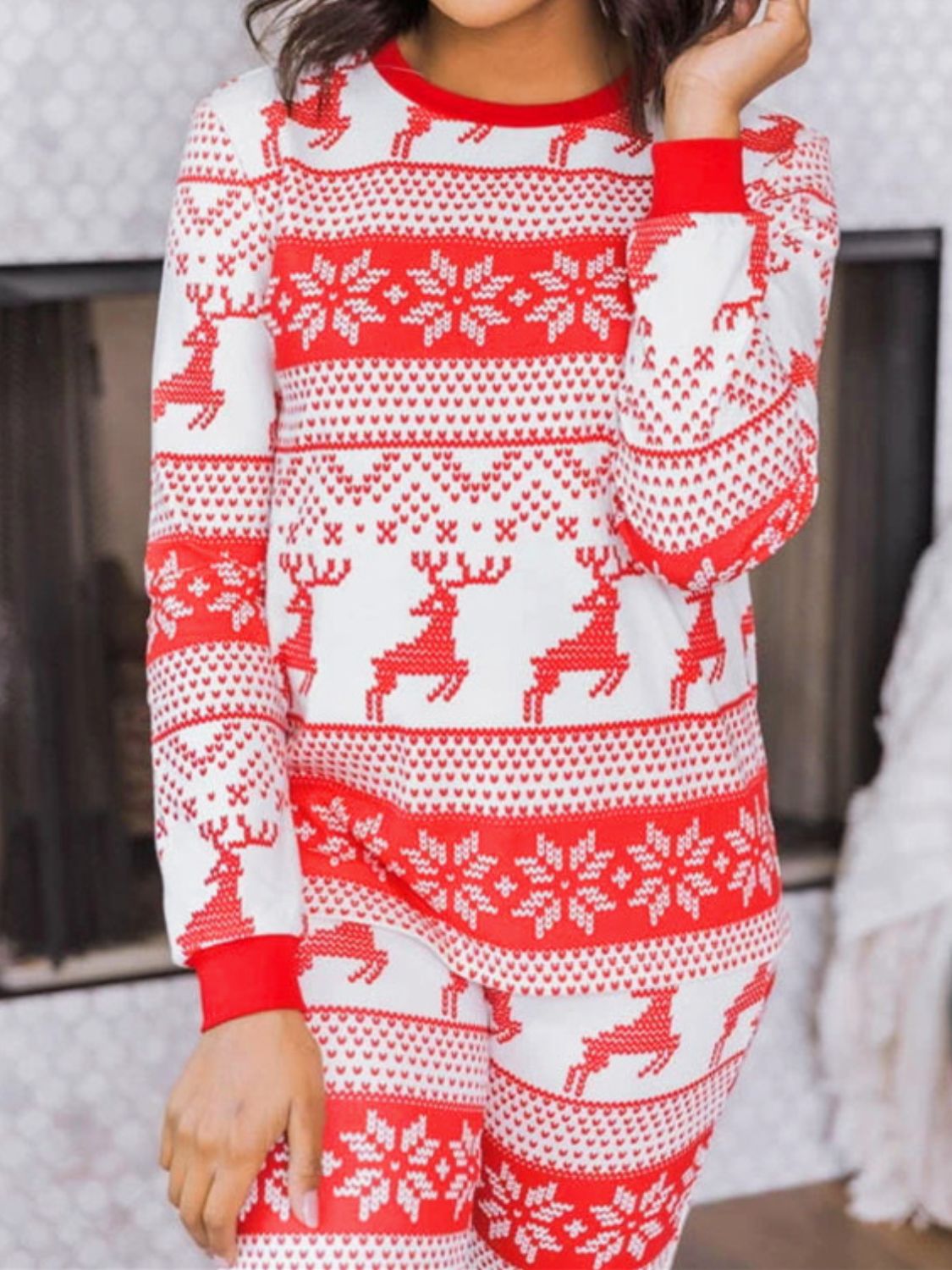 Festive reindeer knit lounge set in orange-red with snowflake pattern, crew neck, long sleeves.