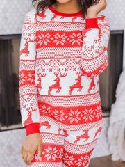 Festive reindeer knit lounge set in orange-red with snowflake pattern, crew neck, long sleeves.