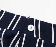 Dark blue vertical stripe palazzo trousers with a zipper and button closure detail.
