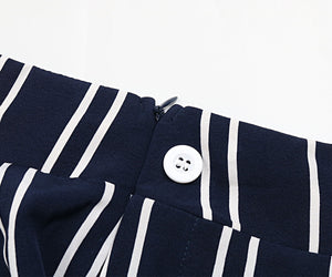 Dark blue vertical stripe palazzo trousers with a zipper and button closure detail.