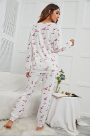 White flamingo print loungewear set with long sleeves and pants.