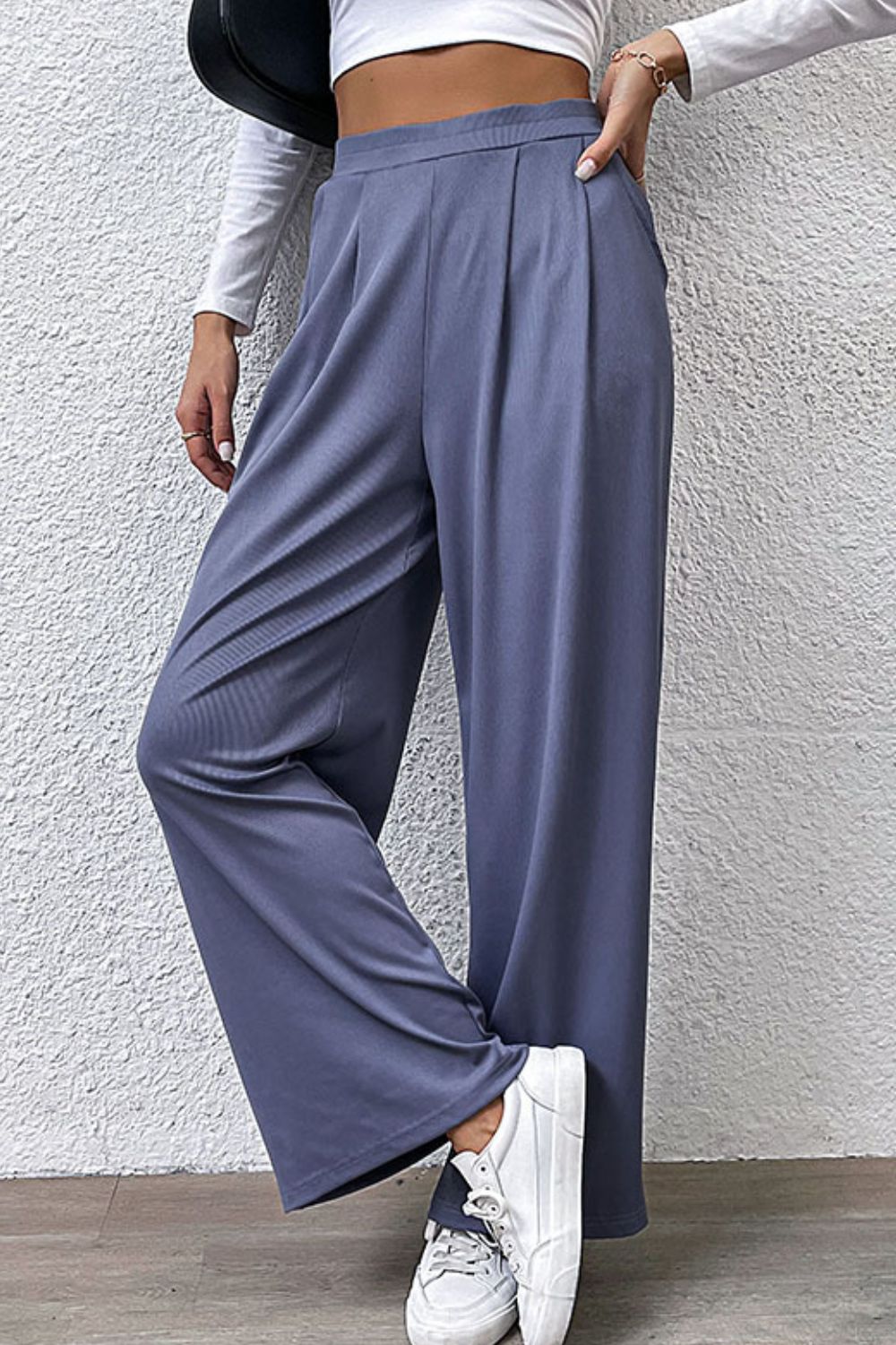 Wide-leg steel pleated front trousers with a comfortable, chic cut.