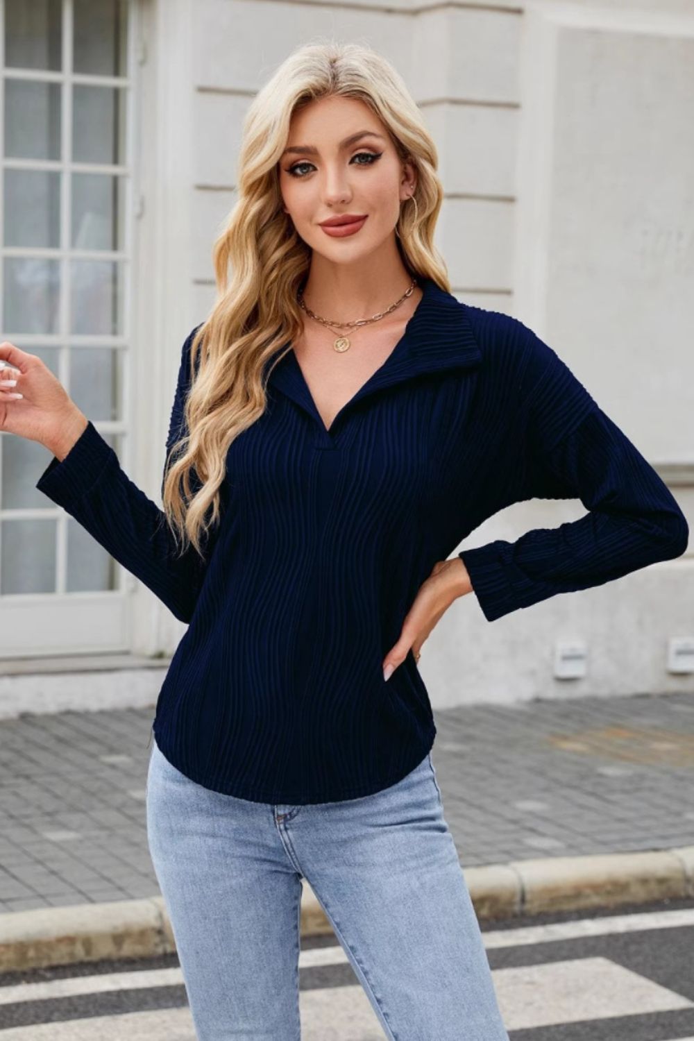Dark Navy pleated wave-effect collared blouse with a V-neck and long sleeves.