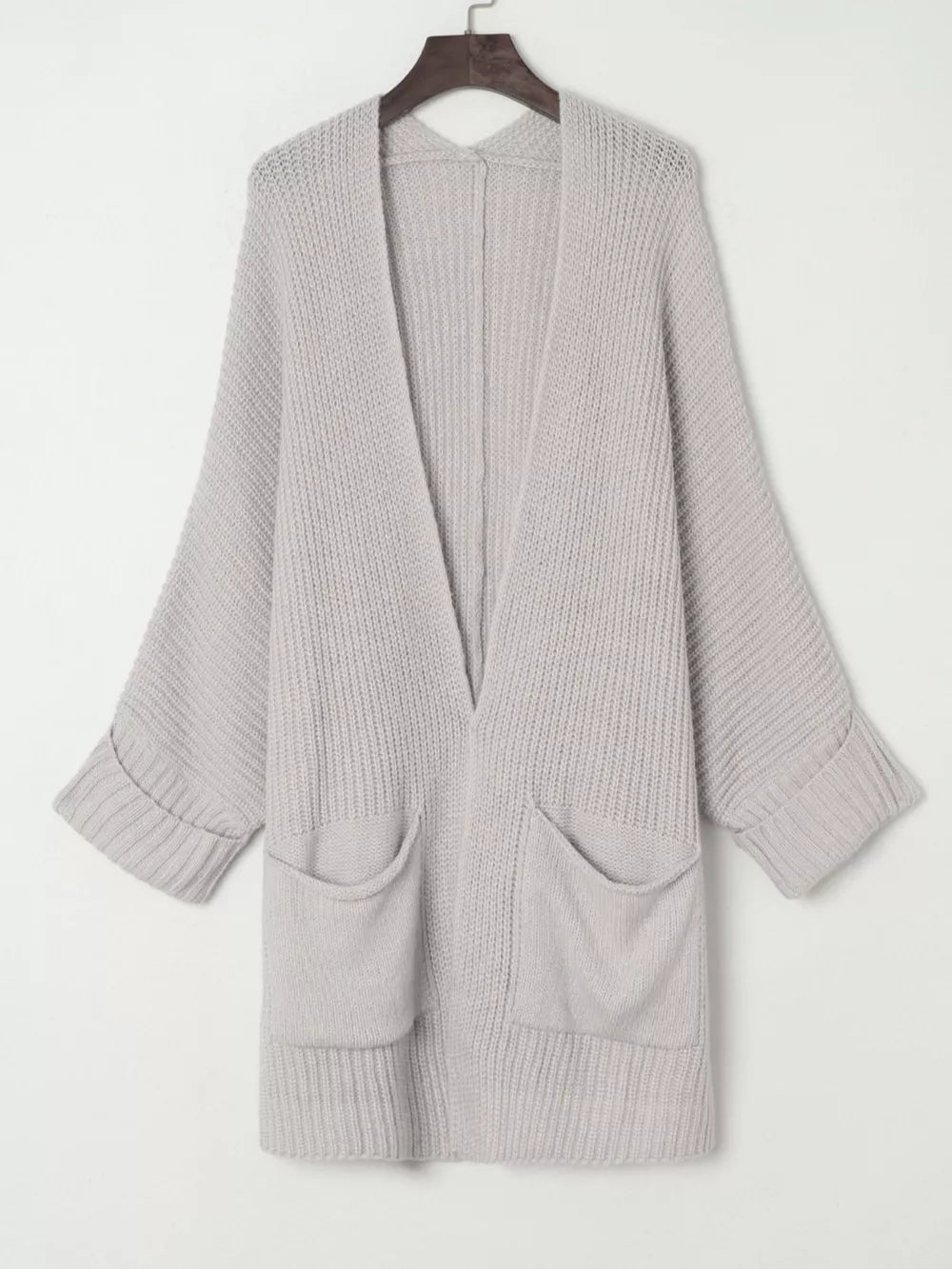 Light grey acrylic open front cardigan with pockets and cuffed sleeves.
