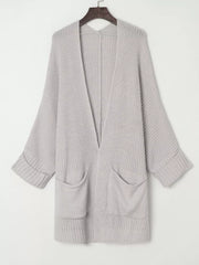 Light grey acrylic open front cardigan with pockets and cuffed sleeves.