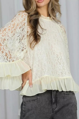 Cream lace maternity shirt with bell sleeves and ruffled hem detail.