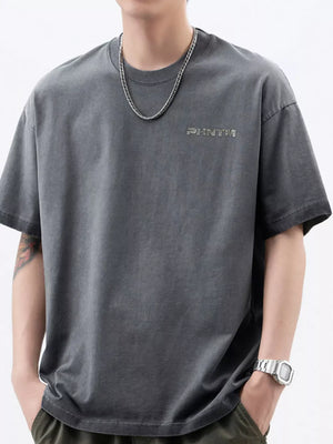 Men's dark gray cotton t-shirt with round neck and subtle front logo detail.