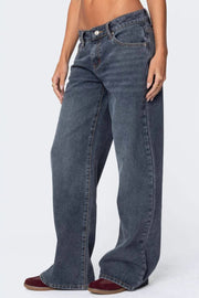 Wide-leg denim jeans in dusty blue with a subtle flare and buttoned closure.
