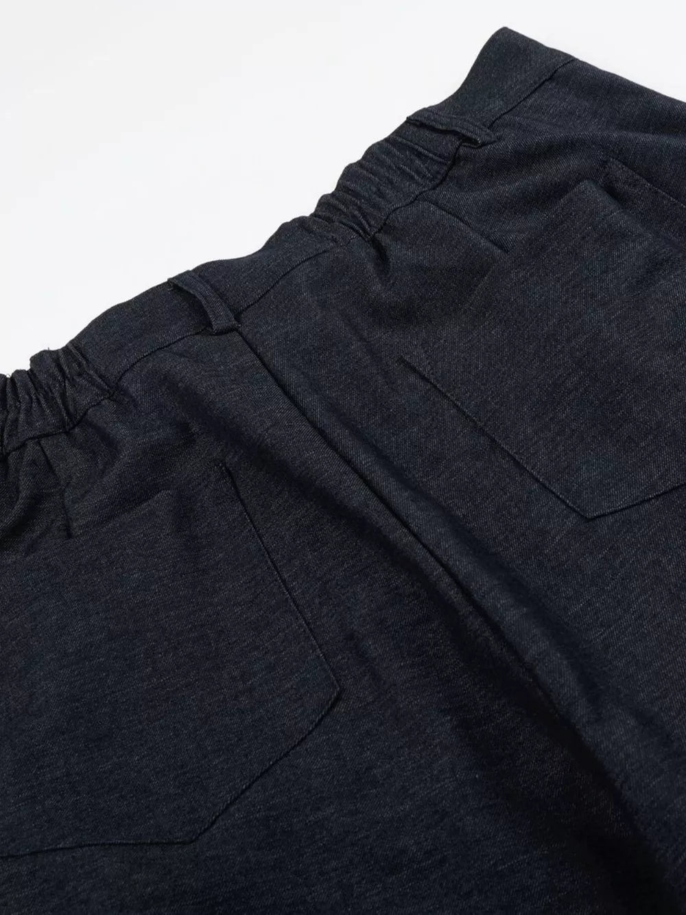 Relaxed fit sweatpants in dark heathered cationic fabric with adjustable waist and back pockets.