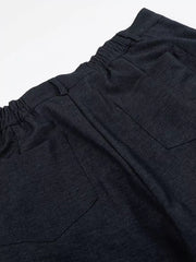 Relaxed fit sweatpants in dark heathered cationic fabric with adjustable waist and back pockets.