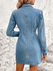 Sculpted denim button-down mini dress in medium wash cotton with long sleeves and a collared neckline.