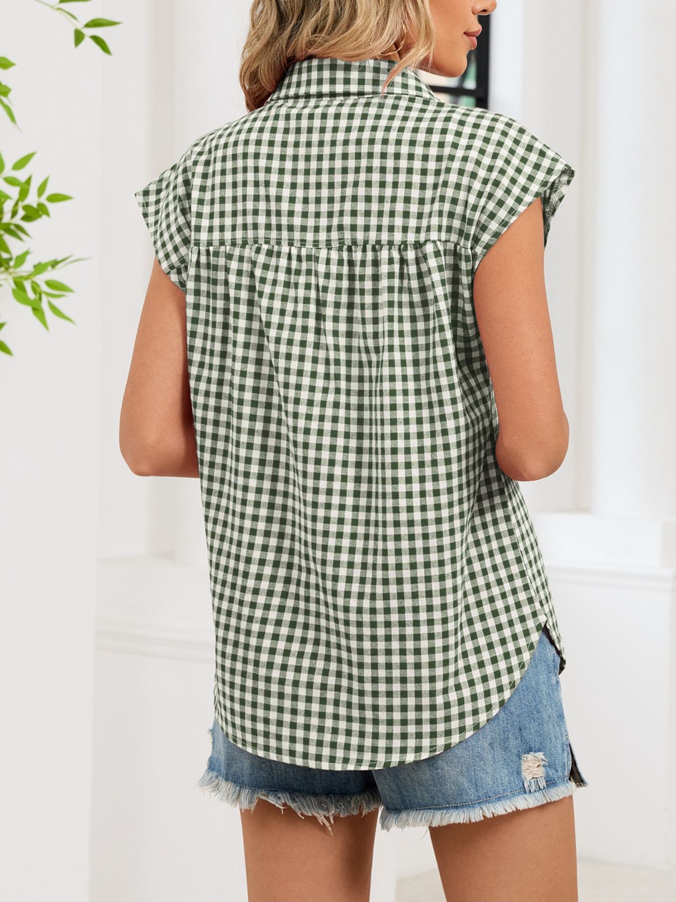 Green gingham cotton shirt with cap sleeves and button-down front, casual style.