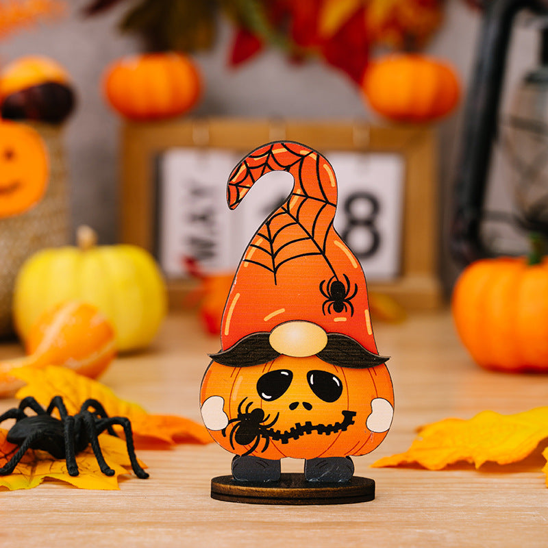 Halloween gnome figurine with pumpkin body, spiderweb hat, and spooky face.