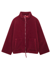 Burgundy sherpa stand-collar jacket with zip front and patch pockets.