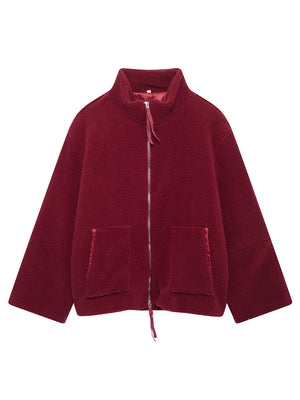 Burgundy sherpa stand-collar jacket with zip front and patch pockets.
