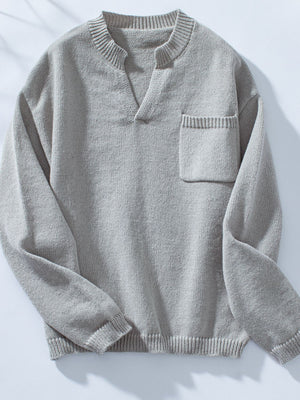 Gray knit sweater with notched neckline and chest pocket.