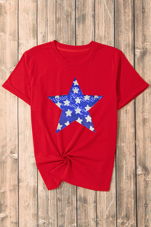 Red cotton blend t-shirt with a blue and white star graphic and a knotted hem.