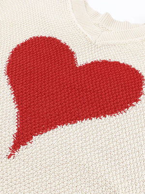 Beige V-neck knit sweater with a large red heart pattern, cotton blend.