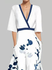 White floral maxi dress with pockets and navy trim, V-neck, short sleeves