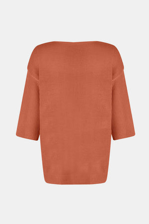 Orange knit sweater with V-neck and flared sleeves.
