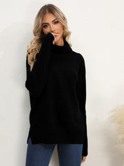 Black acrylic turtleneck sweater with textured knit and oversized fit.