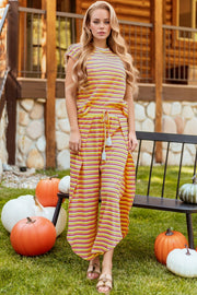 Rainbow stripe culotte jumpsuit in sherbet cotton with drawstring waist and tassel detail.