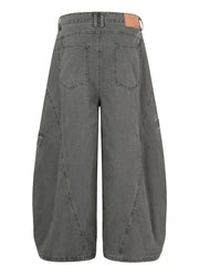 Grey wide-leg cargo pants with large pockets and contemporary stitching detail.