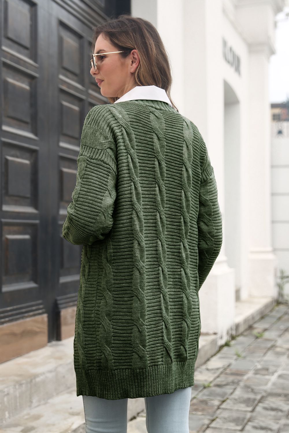 Longline cable knit cardigan in army green with a white collar, acrylic material.