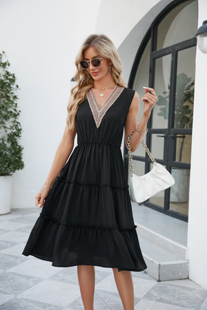 Black sleeveless midi dress with lace-trimmed V-neck and tiered skirt