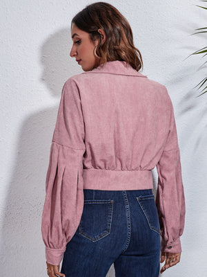 Dusty pink corduroy cropped jacket with balloon sleeves and button details.