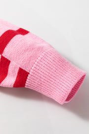 Colorblock stripe knit sweater in hot pink with red stripes and balloon sleeves.