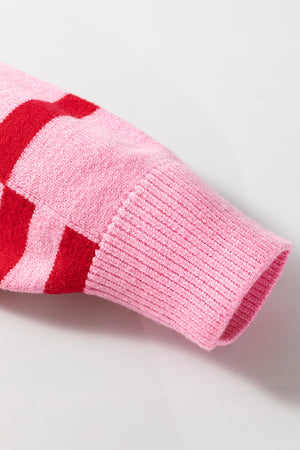 Colorblock stripe knit sweater in hot pink with red stripes and balloon sleeves.