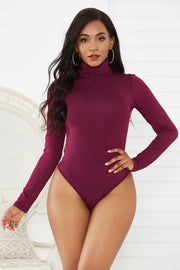 Burgundy turtleneck thong bodysuit with long sleeves.