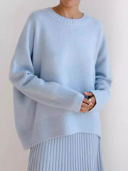 Light blue soft knit sweater with ribbed neckline, cuffs, and hem.