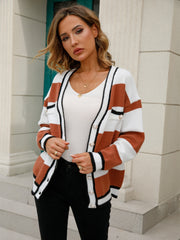 Pearl-trimmed striped knit cardigan in ochre and white with black trim.