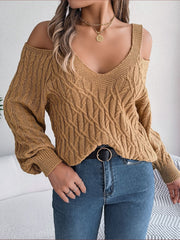 Knit cold shoulder sweater in taupe with cable knit pattern and V-neckline.