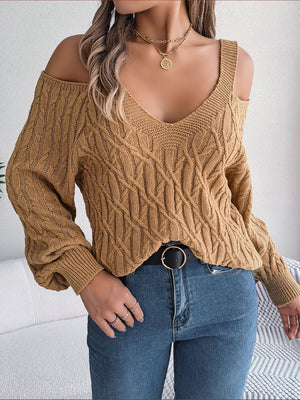 Knit cold shoulder sweater in taupe with cable knit pattern and V-neckline.