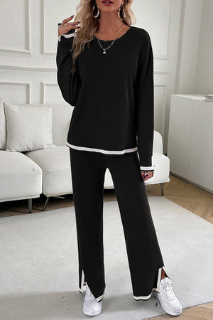 Black ribbed knit loungewear set with white trim on sleeves, hem, and pant cuffs.
