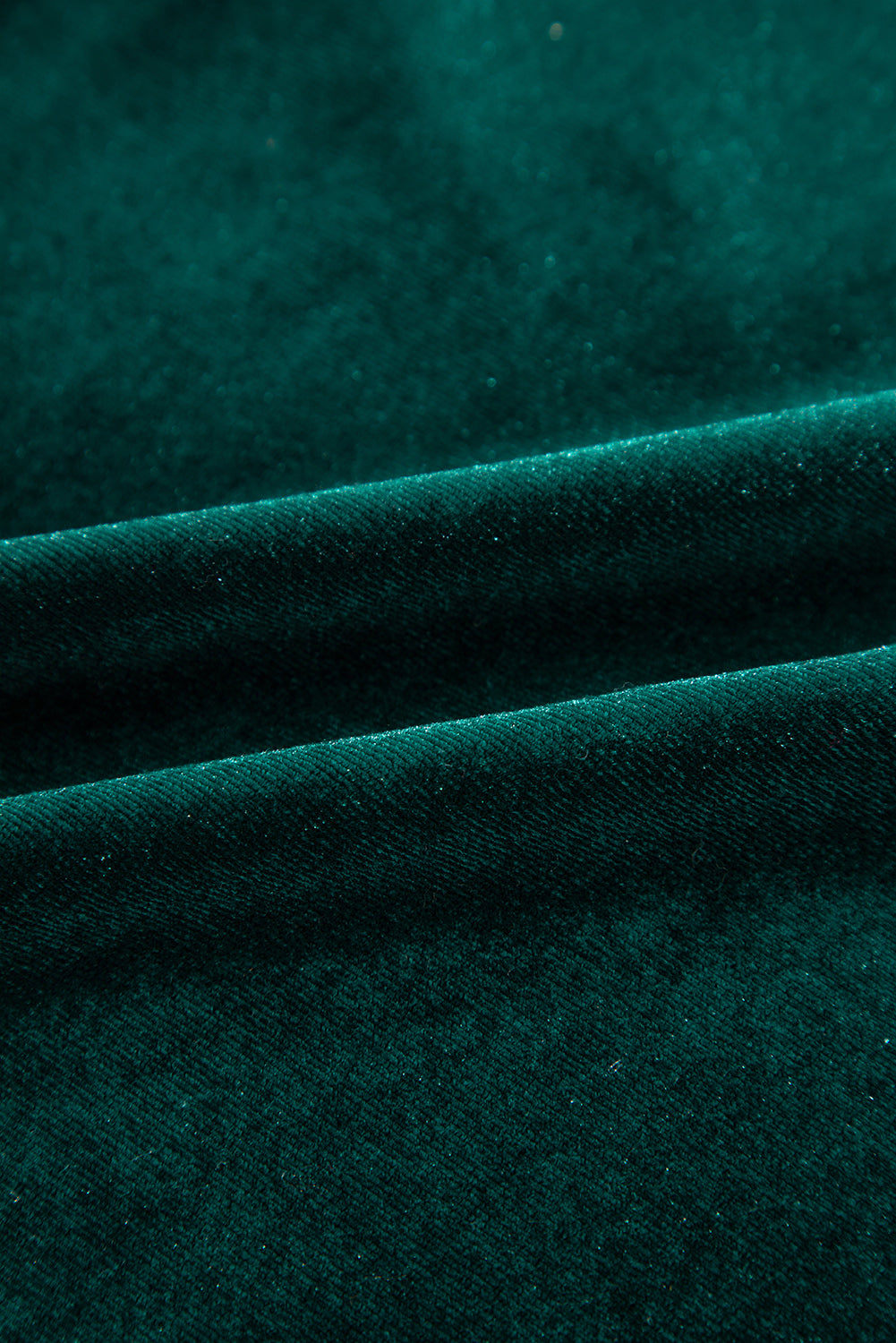 Dark green velvet blouse with subtle sparkle detail