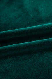 Dark green velvet blouse with subtle sparkle detail