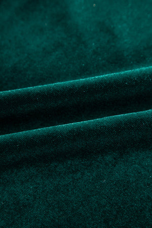 Dark green velvet blouse with subtle sparkle detail