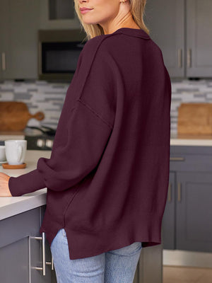 Ribbed-knit relaxed fit sweater in Plum with dropped shoulders and side slits.