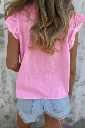 White cotton lace flutter sleeve pleated shirt with ruffled details.