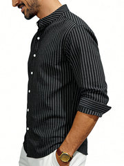 Black pinstripe long sleeve men's shirt with buttoned front and rolled cuffs.