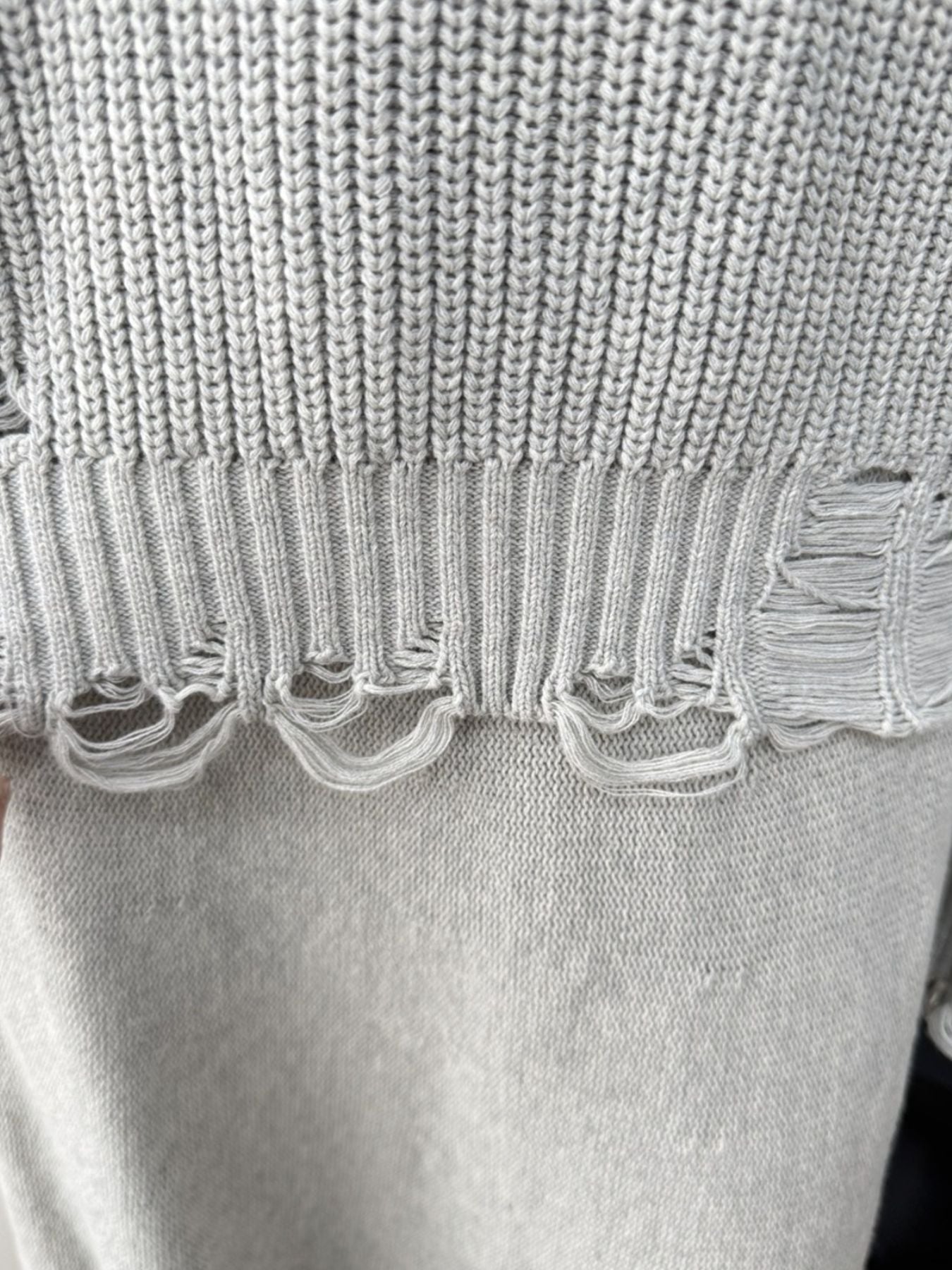 Light gray distressed cotton sweater set with deconstructed hem detail.